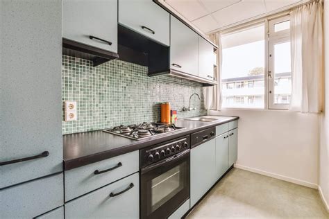 sink next to stove kitchen
